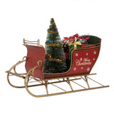 Piros fém szánkó ajándékkal Merry Christmas felirattal